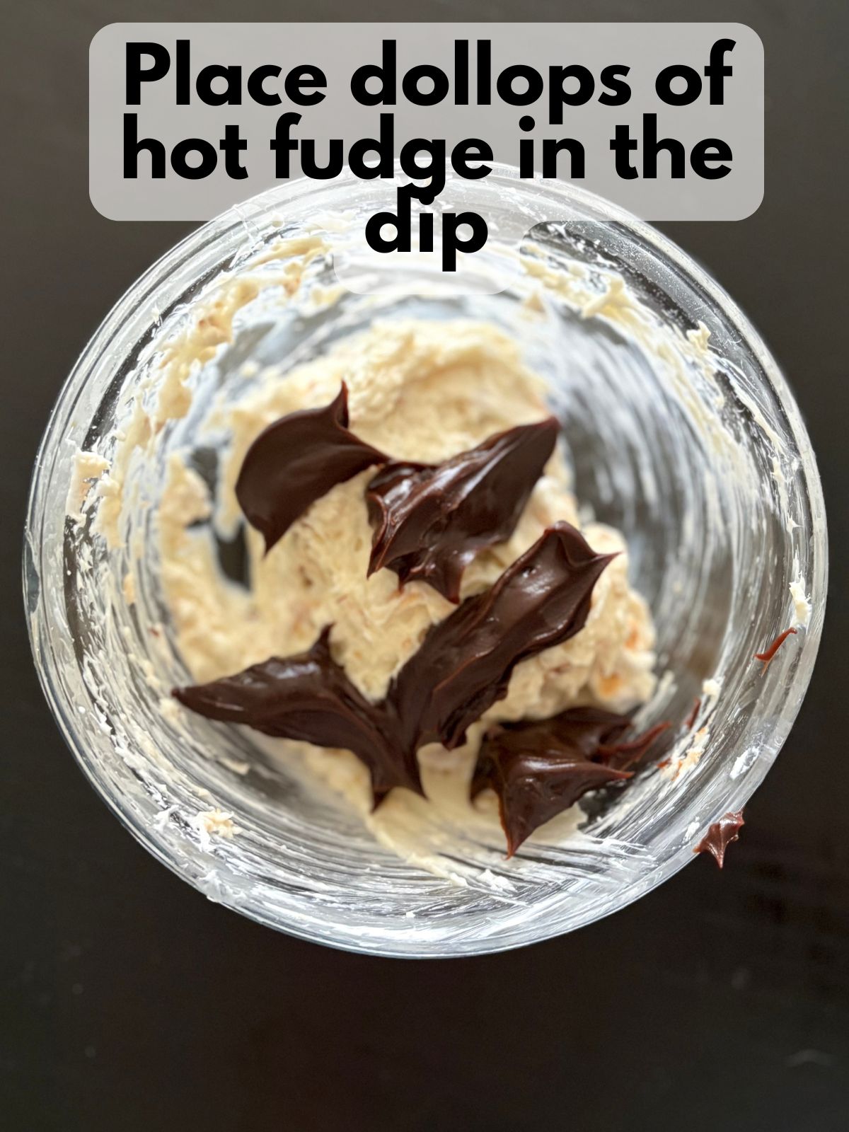 hot fudge dolloped over marshmallow mixture