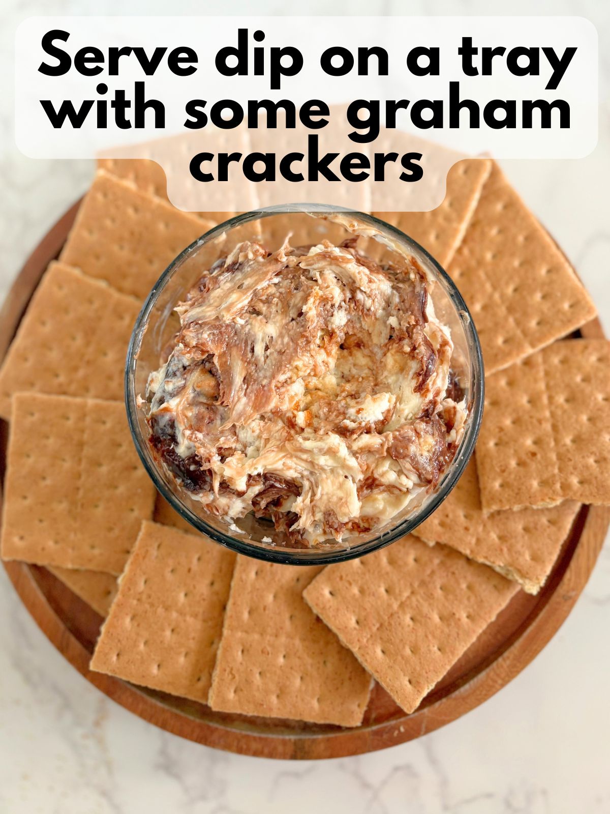 s'mores dip arranged on a platter with graham crackers