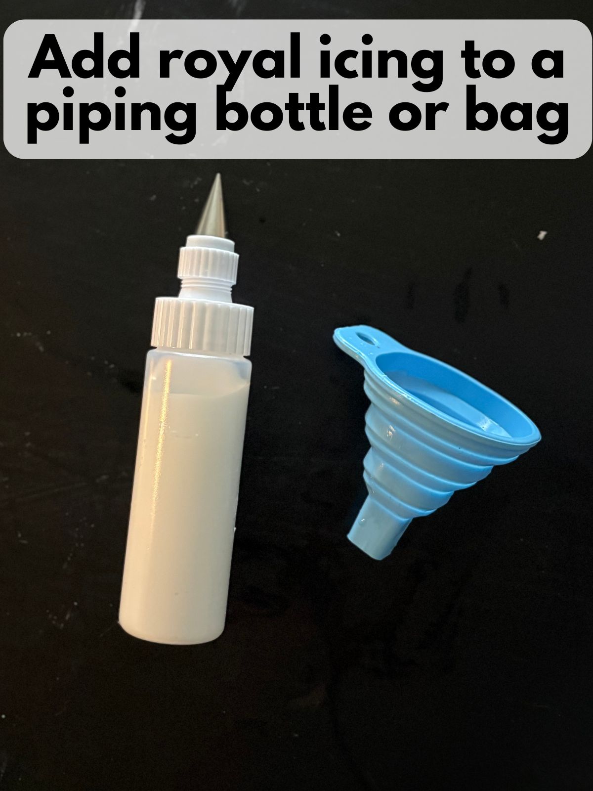 royal icing in a small piping bottle with a plain round tip