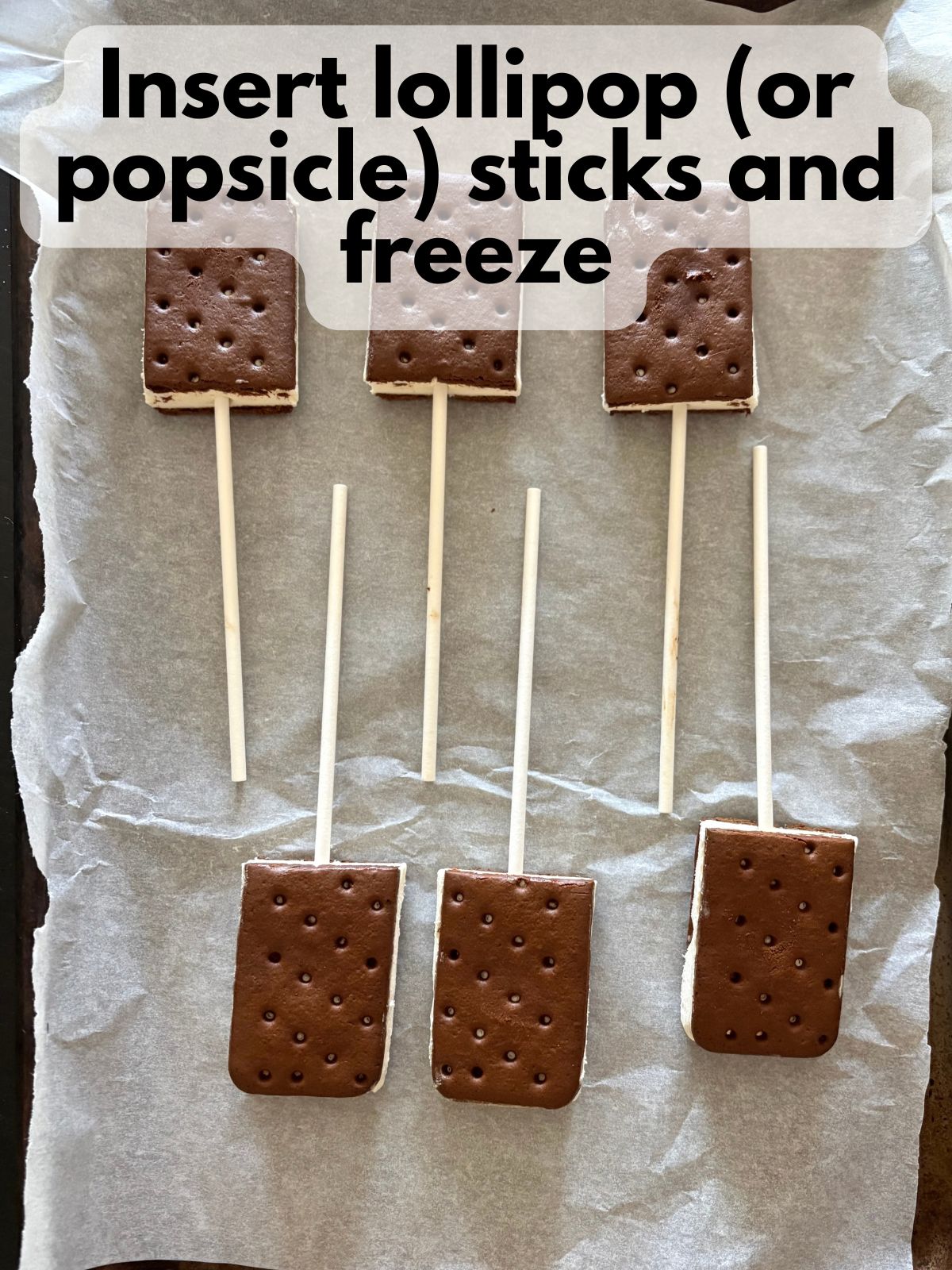 ice cream sandwiches with popsicle sticks stuck in them